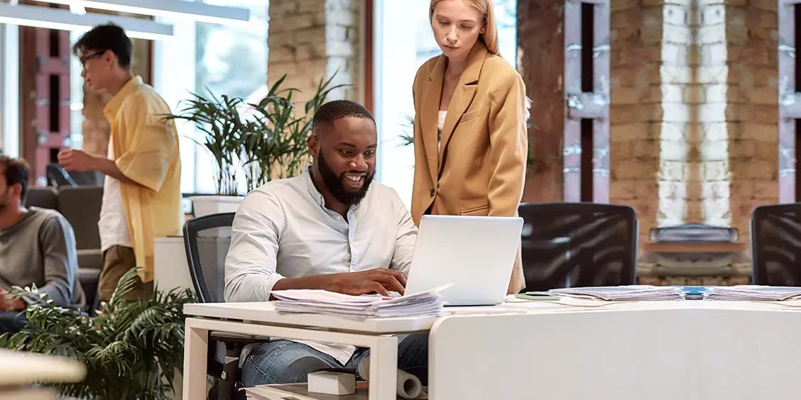 Team working in a modern office during a Microsoft Office 365 migration project for a small business