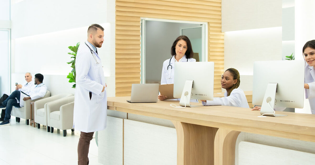 Healthcare staff preparing systems and workstations for a Microsoft Office 365 migration timeline
