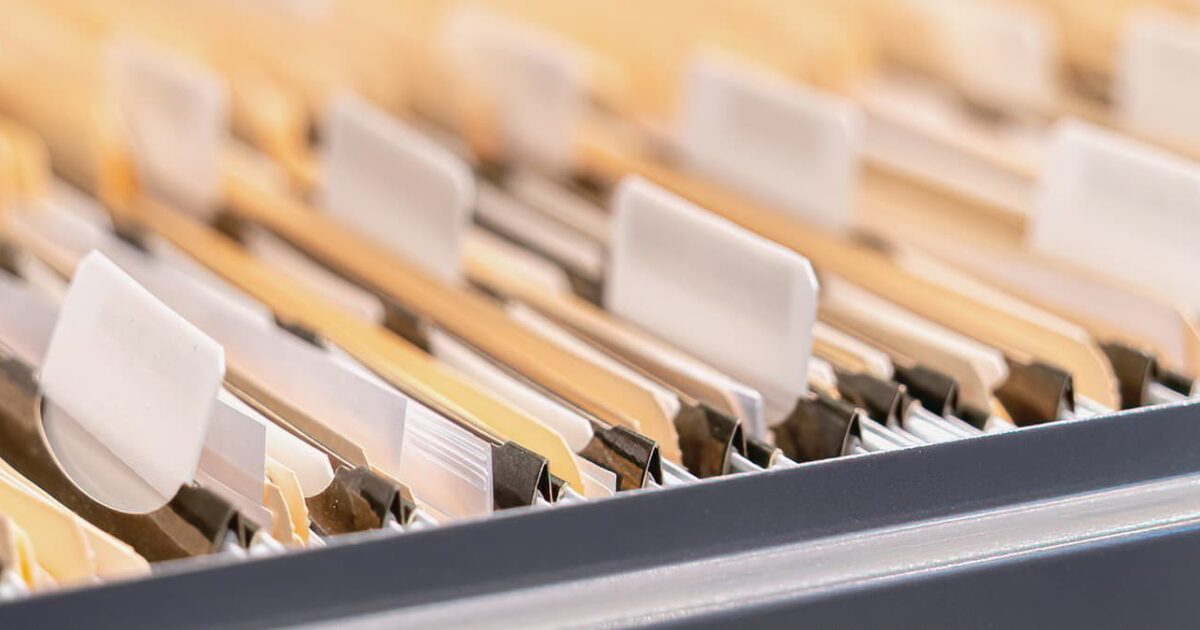 File cabinet with folders and the text Office 365 Migration Data.